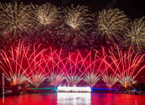 New year countdown celebration fireworks along Chaophraya river, view from Taksin bridge in Bangkok, Thailand photo