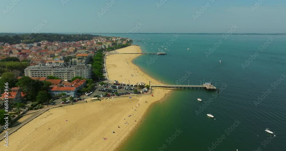 Aerial view Arcachon pier and the adjacent beach. Summer tourist spot, France Aerial view Arcachon pier and the adjacent beach. Summer tourist spot, France