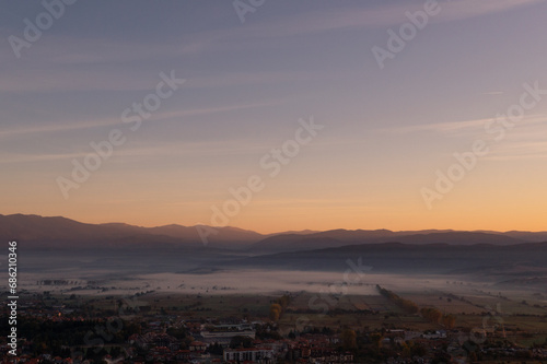 aerial view of foggy morning autumn mountains with clouds bansko bulgaria