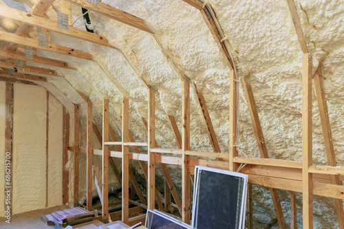 Fotografie Wall of new house under construction is insulated with spray foam thermal hydro