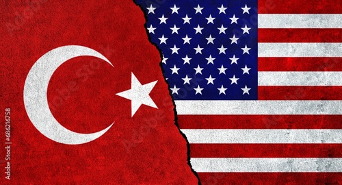 USA and Turkey flag together on a textured wall. Relations between Turkey and United States of America photo