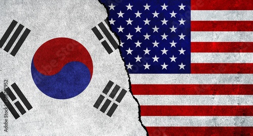USA and South Korea flag together on a textured wall. Relations between South Korea and United States of America photo