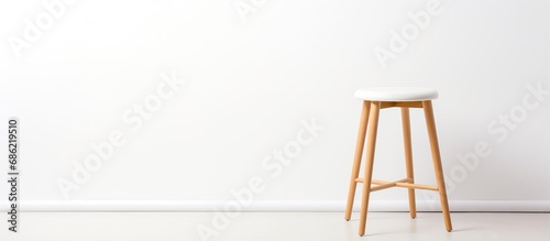White wooden stool isolated on a white background photo