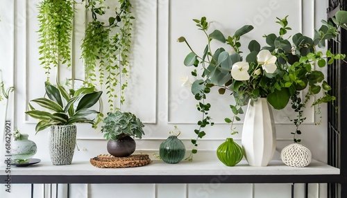 green interior decoration on a shelf plants in vases against a white bathroom wall wallpaper in a contemporary vacation style for the summer fashionable lifestyle scene mantel light design with flo photo