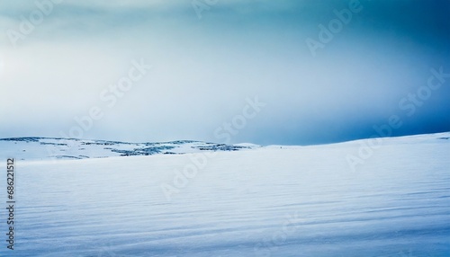 a beautiful minimalist landscape of flat snowy norwegian field clean light high key decorative look © Mary