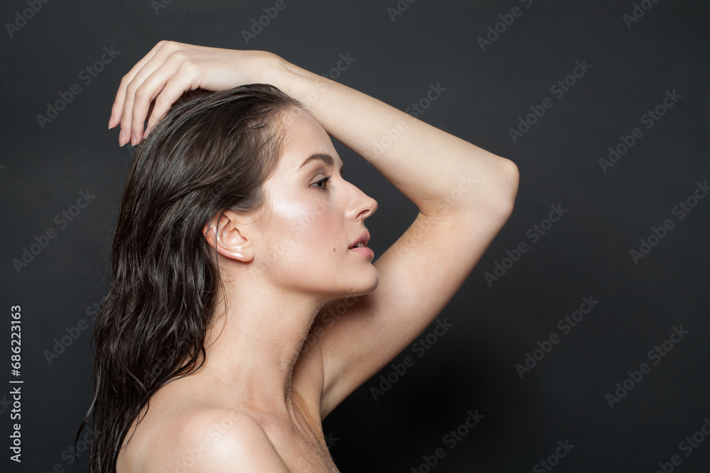 Naklejka premium Wellness brunette woman portrait. Beautiful spa model with perfect fresh clean skin. Youth and skin care concept. Nude makeup