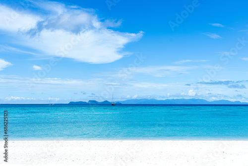 Beautiful sea, Tropical Turquoise clear blue sea and white sand beach with long tail boats  at Lipe Island  Satun Thailand  © Anusara