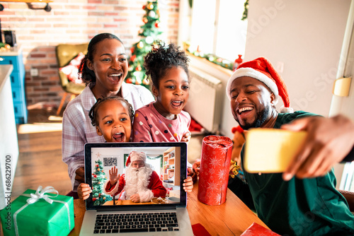 Family Video Call with Santa Claus on Christmas Morning photo