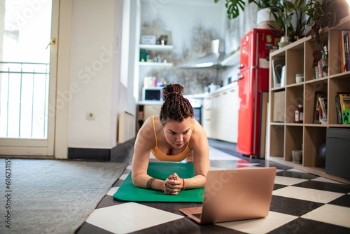 Online Yoga Class Participation by Woman at Home photo