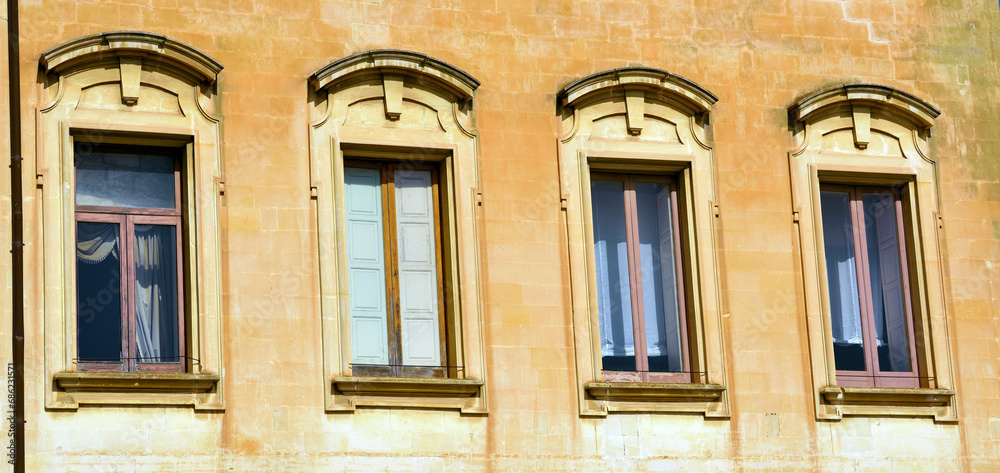 balconies of ancient houses in historic Lecce Italy