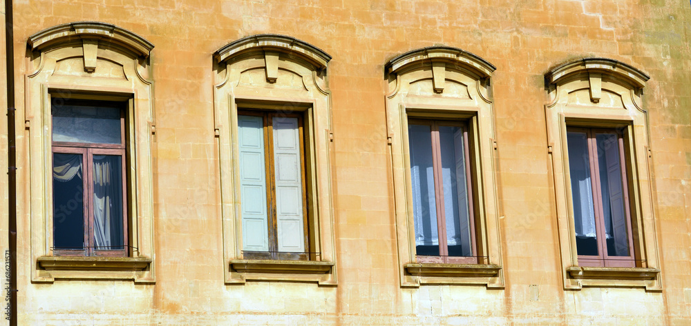 Fototapeta premium balconies of ancient houses in historic Lecce Italy