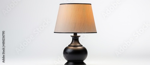 Black table lamp with a sleek design on a white background