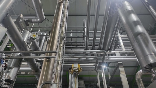 Stainless steel pipe, gauge and valve in production room of factory 