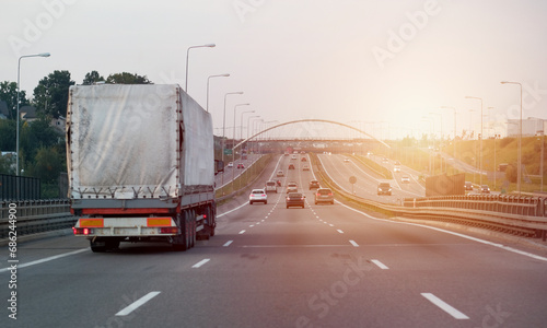 A Cargo Truck On The Intercity Highway Motorway With Three Lanes. TIR International Trade Logistics