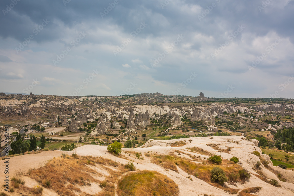 Rocky landscape in Cappadocia, Turkey. Travel in Cappadocia. Unusual semi-desert mountain ranges. Amazing Rocky summer landscape in Cappadocia Goreme Rocky landscape in Cappadocia, Turkey. Travel in Cappadocia. Unusual semi-desert mountain ranges. Amazing Rocky summer landscape in Cappadocia Goreme