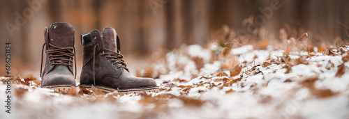 Waterproof leather hiking ankle boots in snow are perfect for autumn or winter explorations and adventure. Outdoor shoes