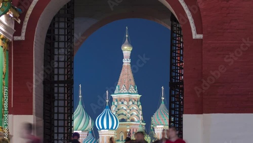 View to St Basil's Church through Iberian Gate or Resurrection Gate of historic Kitai-gorod Wall in Moscow, Russia timelapse. The Gate between the north-western end of Red Square and Manege Square
