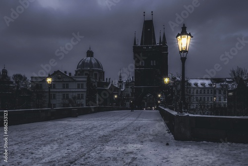 Prague at night with lit lanterns, Charles bridge city, 