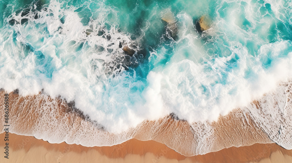 ฺBlue ocean waves crashing on rocks and beach Aerial top view of blue seascape white air foam. The beauty of the sea with free space ,background surface , Texture