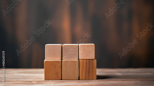 A stack of wooden blocks cube on top of a wooden table. Copy space, Business art concept