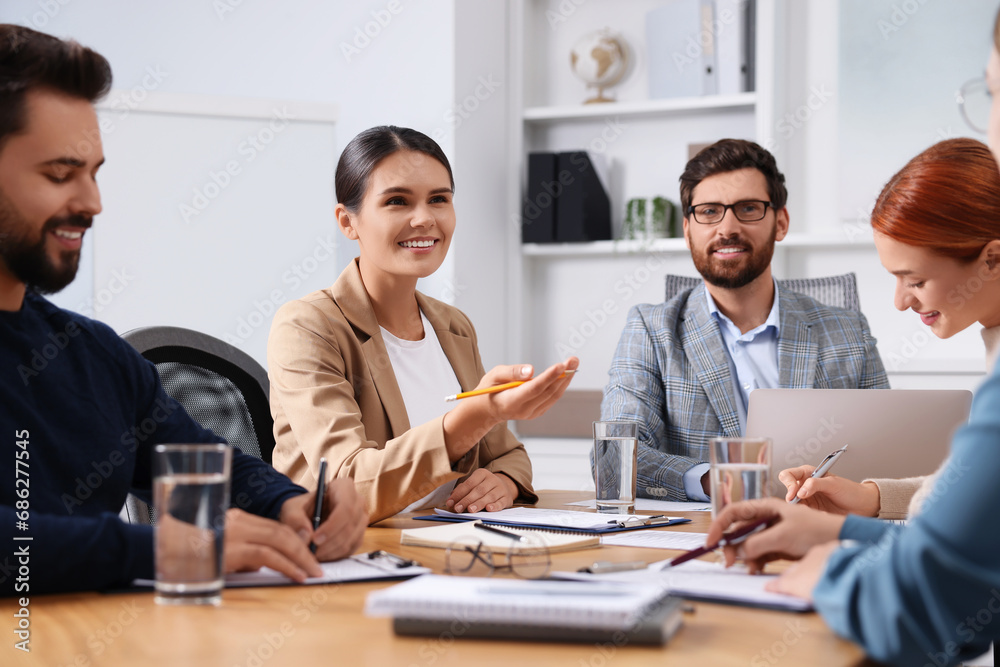 Team of employees working together in office Team of employees working together in office