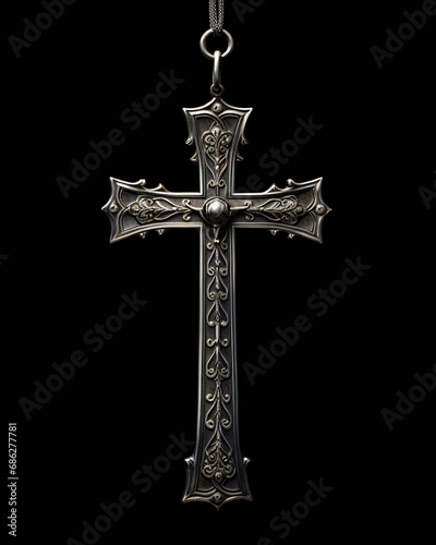 Christian symbol - silver cross isolated on black background studio light.