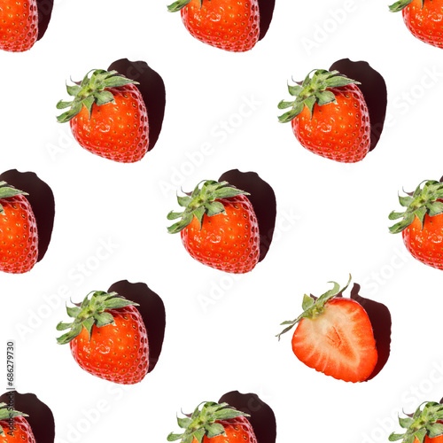 Fototapeta Naklejka Na Ścianę i Meble -  Seamless pattern of whole berries of red ripe strawberries and one cut half of a berry with a shadow on a white background