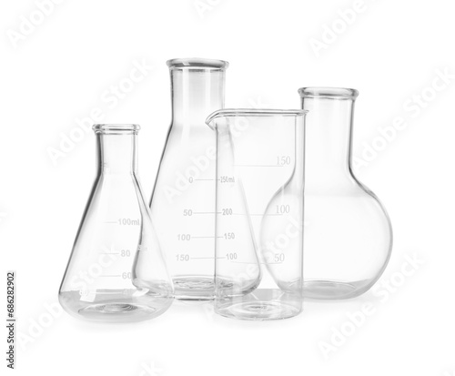 Many laboratory flasks and beaker isolated on white