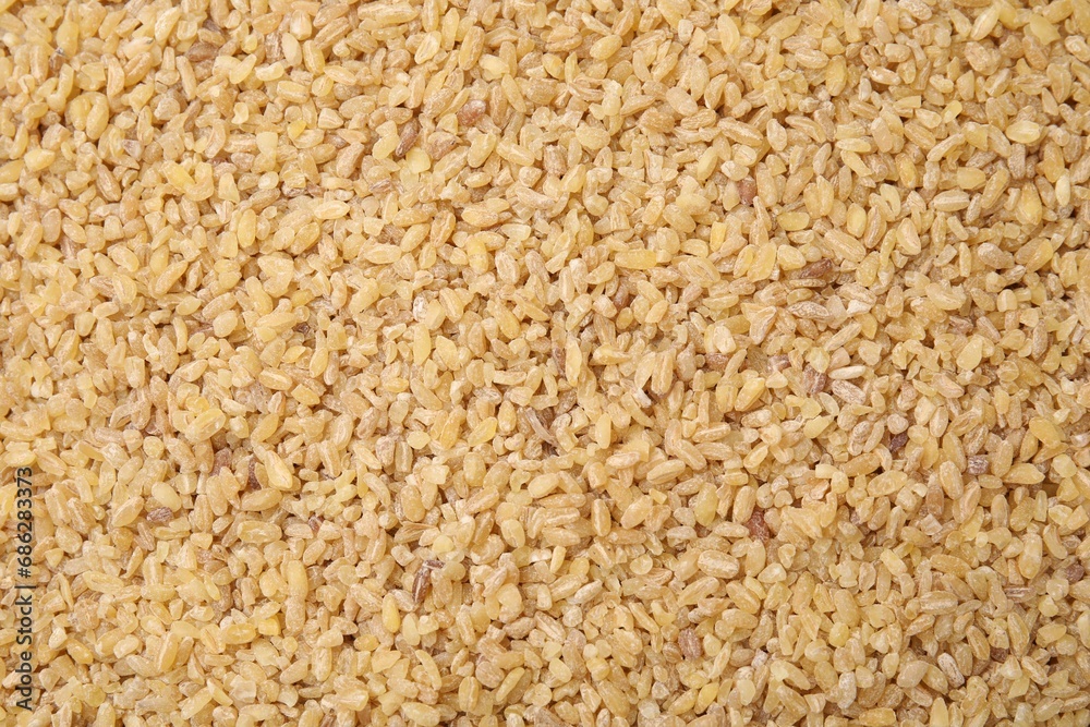 Uncooked organic bulgur as background, top view Uncooked organic bulgur as background, top view