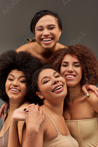 appealing happy african american women in comfy underwear having great time together, fashion
