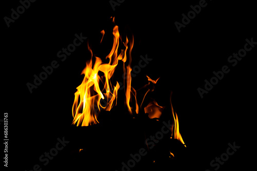 Fire flame texture. Burning material backdrop. Burn effect pattern. Blaze and torch wallpaper. Heat and haze backdrop.