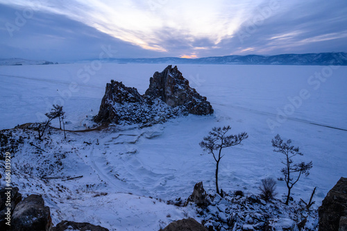 Shamanka Rock. sunset. Olkhon Island. snowy and frosty winter. photo