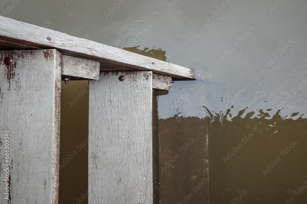 Serene Waters: Weathered Wooden Dock stair into water with Calm Lake Reflections Serene Waters: Weathered Wooden Dock stair into water with Calm Lake Reflections