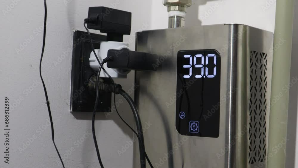 A boiler with a thermometer and a display with numbers that decrease as the temperature decreases. A boiler with a thermometer and a display with numbers that decrease as the temperature decreases.