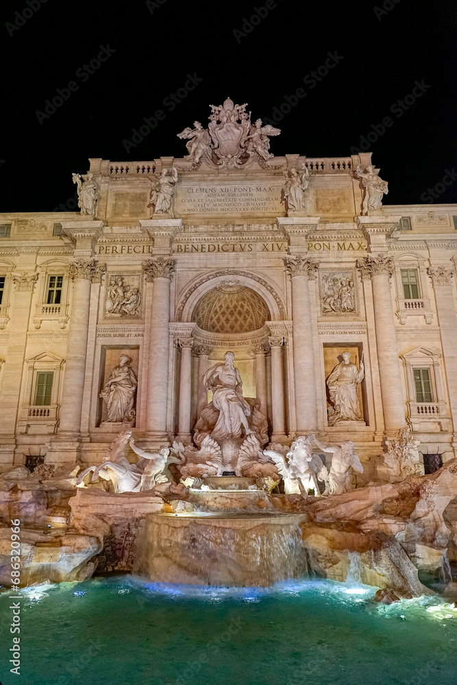 front and center image of the Trevi Fountain at night. City of Rome, Italy
