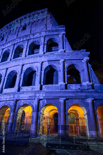 Canvas Print Rome coliseum facade with blue light projection to commemorate international epi