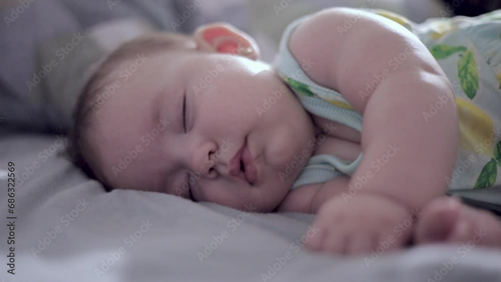 baby sleeping peacefully with selective focus on hand baby sleeping peacefully with selective focus on hand