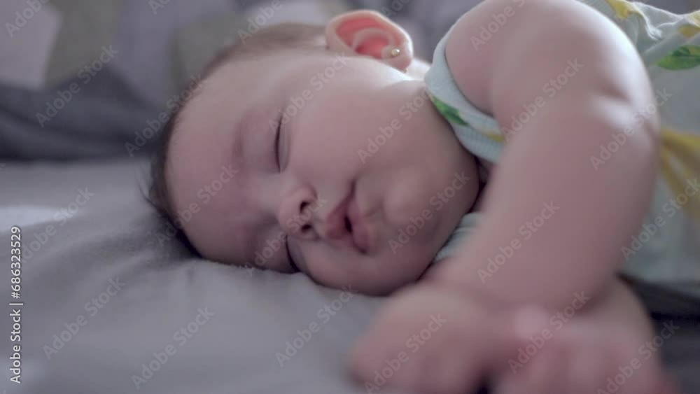 baby sleeping peacefully with selective focus on hand baby sleeping peacefully with selective focus on hand