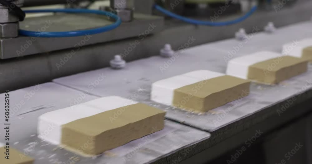 Industrial ice cream production line. Closeup view of ice cream tablets machine. Industrial ice cream production line. Closeup view of ice cream tablets machine.