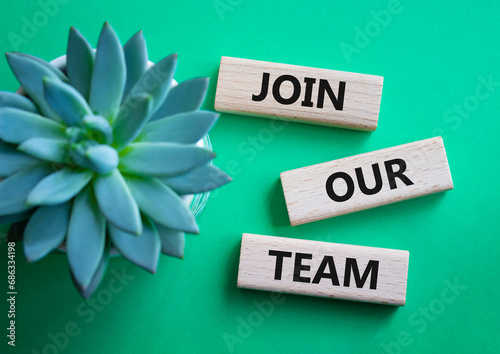 Join our team symbol. Wooden blocks with words Join our team. Beautiful green background with succulent plant. Business and Join our team concept. Copy space.