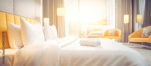 Blurred luxury hotel bedroom interior for background