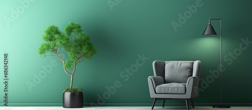 Green chair and frameless picture on gray wall
