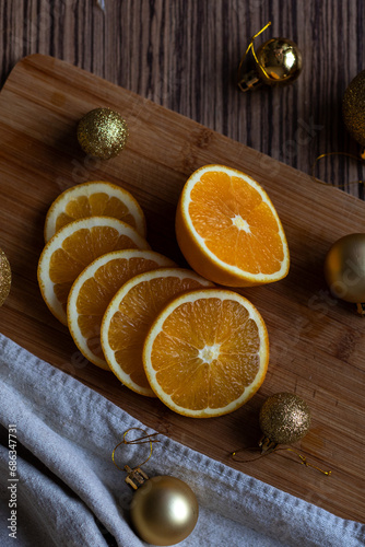 New Year's layout of oranges, board, napkins, garlands and balloons on the kitchen table.Preparations for the holiday.Preparing for the celebration of Christmas.The concept of a cozy kitchen