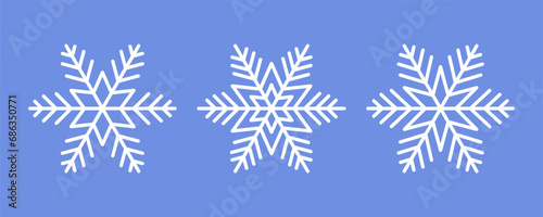 White Snowflakes on blue background. Vector Winter isolated icons in silhouette. Snow Cristals. Simple Line Style
