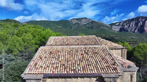 Church of Santiago and landscape in the surroundings of Los Mallos and the town of Agüero. Aerial view from a drone. Hoya region of Huesca. Huesca. Aragon. Spain. Europe photo