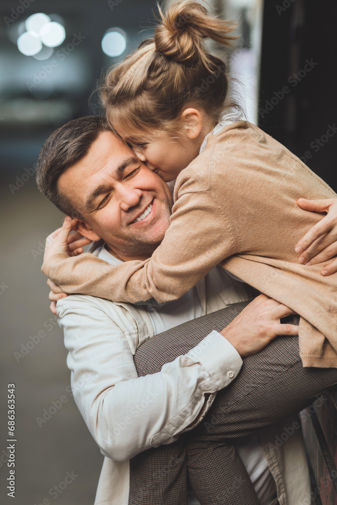 Dad and teenage daughter having fun on a walk in the city. Dad and teenage daughter having fun on a walk in the city.
