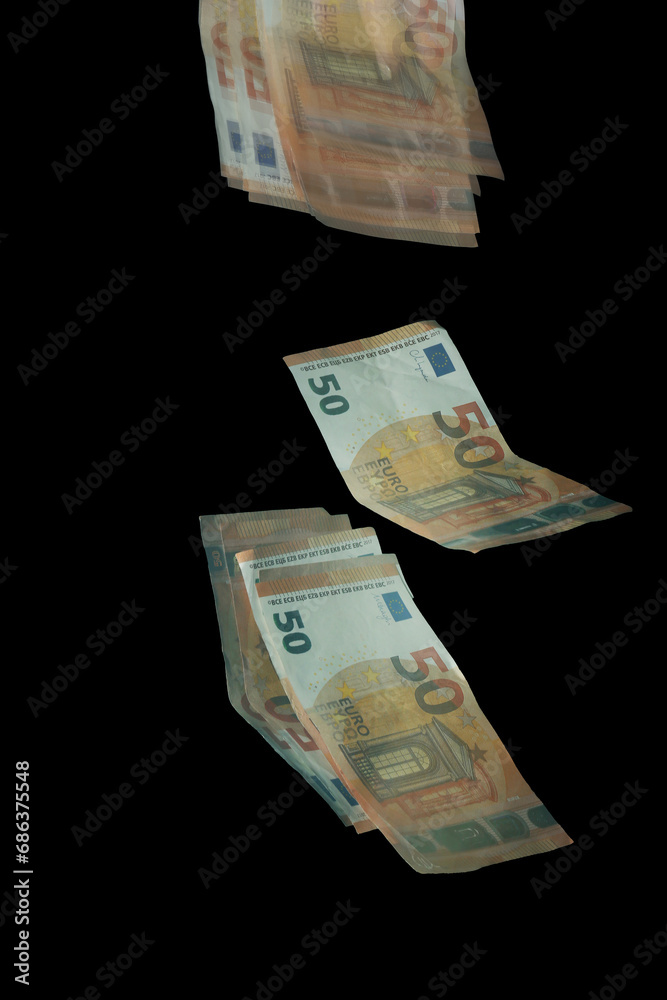 Stroboscopic photo of falling euro banknotes on dark background Stroboscopic photo of falling euro banknotes on dark background
