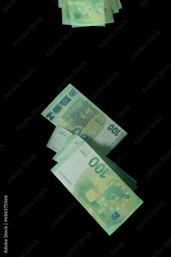 Stroboscopic photo of falling euro banknotes on dark background Stroboscopic photo of falling euro banknotes on dark background