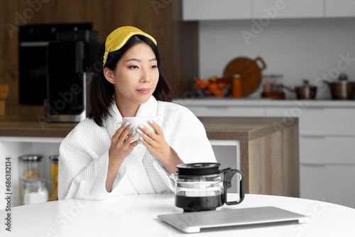 Young asian woman in a whit...