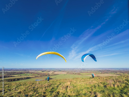 Paragliding group on outdoor, clear day, Autumn, Berkshire England
